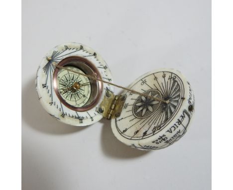 A reproduction bone effect miniature globe compass, 5cm