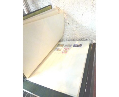 STAMP ALBUMS. Two stamp albums including Commonwealth and worldwide postage stamps