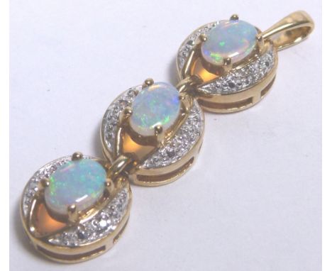 9 K MINTABIE JELLY OPAL PENDANT. 9 k gold mintabie jelly opal and diamond three opal pendant, 5,23g