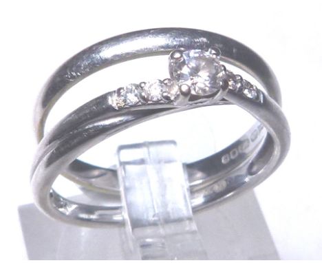 TWO 9 CT RINGS. 9 ct white gold diamond solitaire ring , size L and a 9 ct white gold wedding band, size M