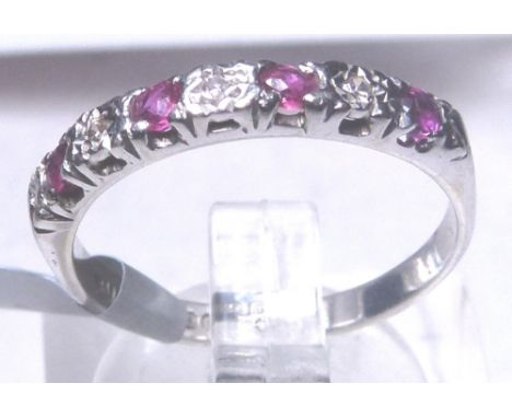 9 CT HALF ETERNITY RING. 9 ct white gold ruby and diamond set half eternity ring, size K