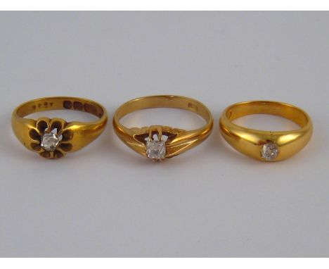 A mixed lot comprising three old brilliant cut diamond solitaire rings, two yellow metal (tests 18 carat gold), one hallmarke