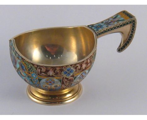 A Russian silver gilt shaded enamel cloisonne kovsh. Marks for Ivan Khlebnikov, Imperial Warrant, Moscow, 88 standard, 1908-1