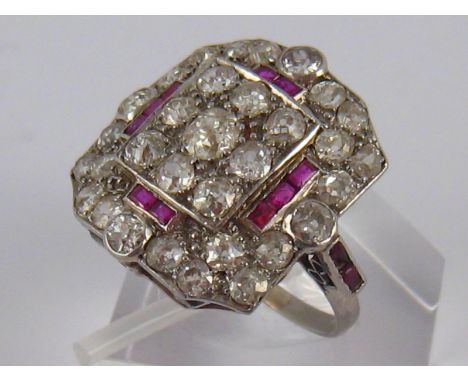 An Art Deco white metal (tests platinum) old brilliant cut diamond and ruby ring, circa 1930's, estimated total diamond conte