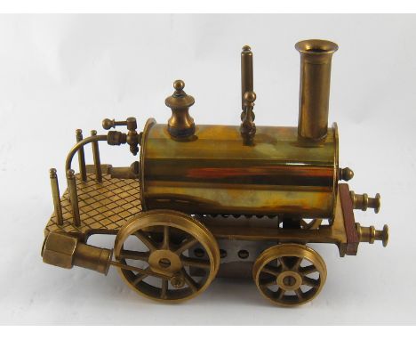 A 2.5" gauge 0-2-2 brass model live steam engine, based on Stephenson's Rocket, unused in original box by Precision Steam Eng