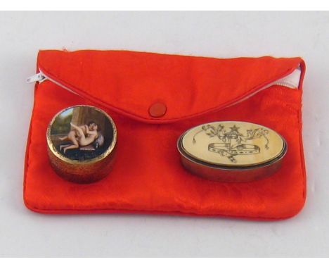 Erotica. A satin purse containing two metal pill boxes, one circular with enamel of erotic couple on the lid, 3.5cm. diameter