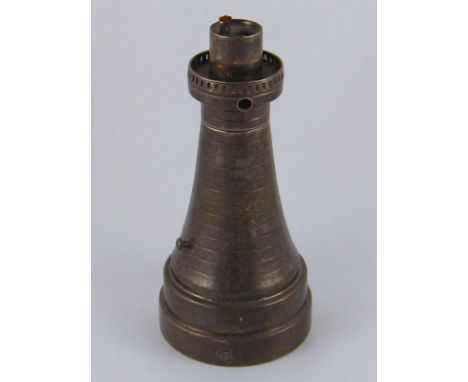 A silver battery operated table lighter shaped as a lighthouse, incomplete. Saunders and MacKenzie, Birmingham 1934. Ht.13cm.