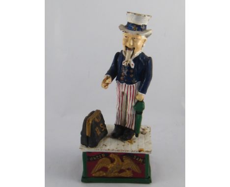 An Uncle Sam cast iron push button mechanical money box. Ht.27cm. 