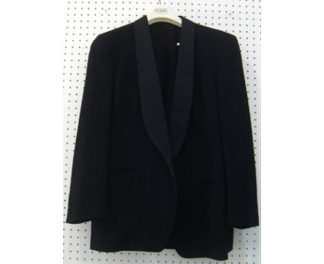 A Giorgio Armani black cocktail suit. One button pure new wool jacket with a shawl collar, possibly silk. Size M/L.