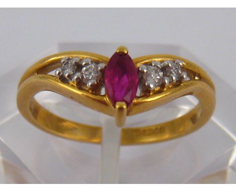 An 18 carat gold ruby and diamond ring, size M, 3.2 gms.
