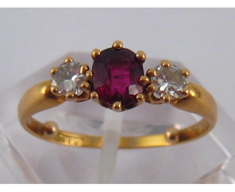 A fine yellow metal (tests 18 carat gold) ruby and diamond ring, ruby approx 6 x 5mm, ring size O (with sizing beads), 3 gms,