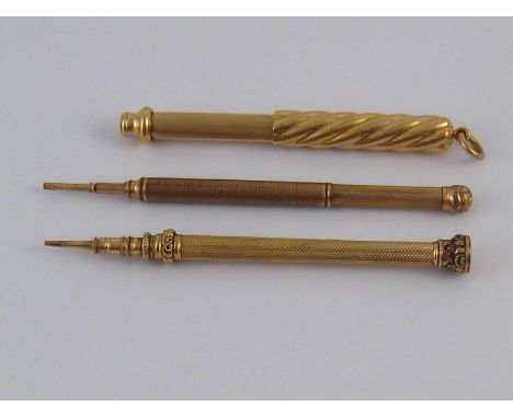 Two untested yellow metal mechanical pencils, and a gold plated mechanical pencil marked W.S. Hicks New York.