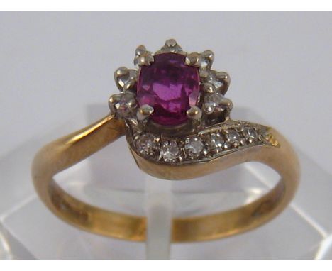 A 9 carat gold ruby and diamond ring, ruby approx 5 x 4 mm, ring size O, 2.5 gms.