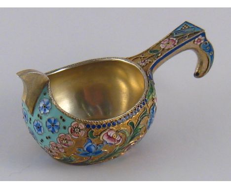 A Russian silver gilt kovsh with cloisonne shaded enamelled flowers. 11th. Artel, Moscow, 88 standard, 1908-1917. length 9.5c