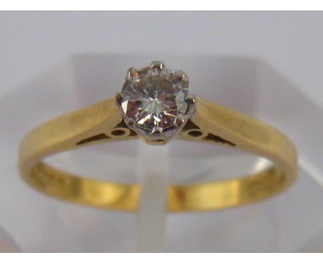 An 18 carat gold diamond solitaire ring, the round brilliant cut diamond estimated to weigh approx 0.16 carat, ring size K, 1