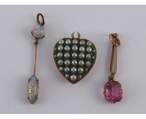 A mixed lot comprising a yellow metal (tests 9 carat gold) opal pendant and two untested pendants.
