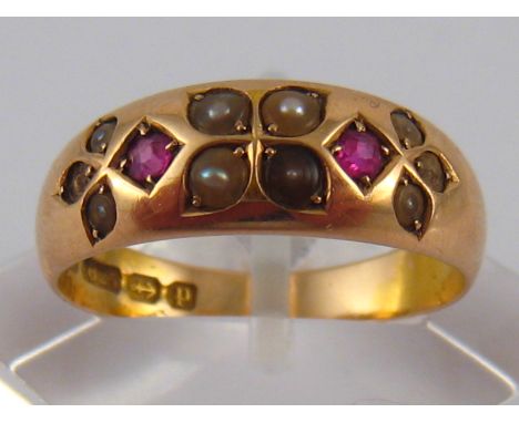 An antique 15 carat gold ruby and seed pearl ring, hallmarked Birmingham 1889, ring size N, 4.1 gms.
