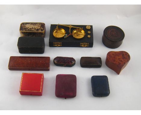 A mixed lot comprising a balance scale and ten jewellery boxes.
