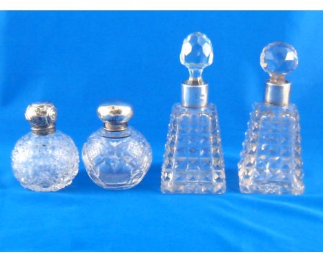 A pair of late Victorian pyramid shaped silver mounted cut glass scent bottles, one stopper replaced, by George Betjemann & S