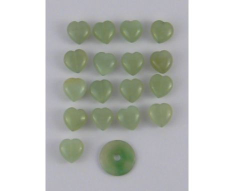 A quantity of jade heart pendants and a jade disc pendant, disc approx 3cm diameter.
