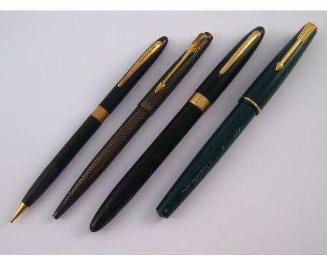 Two Parker pens, a green “17” Duofold and a silver cased ballpoint, and a Sheaffer, Australia, pen and pencil.