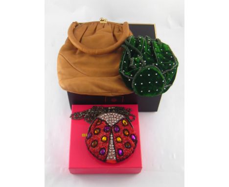 A Butler & Wilson beaded evening bag together with two vintage evening bags. 