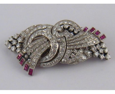 A white metal (tests 18 carat gold and platinum) diamond and ruby double clip brooch, estimated total diamond content approx 