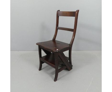 A reproduction mahogany metamorphic library step chair. Dimensions as steps 86x86x37cm, as chair 42x86x37cm.Used condition ov