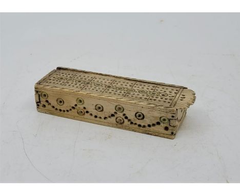 An early 19th century Napoleonic Prisoner of War work bone cribbage board, with pierced sliding top, length at base 12.2cm.Co