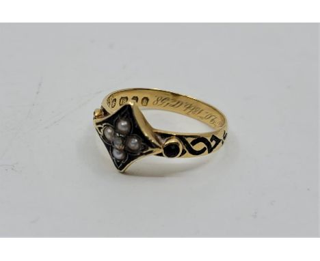 A Victorian 18ct. gold, black enamel and gem stone set memorial ring, set central rose-cut diamond bordered by pearls with ro