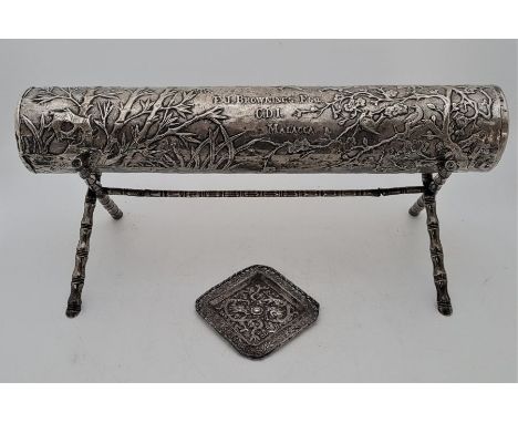 A white metal cylindrical scroll holder, probably Chinese export, fashioned for E.J.Brownings Esq. C.D.I Malacca, embossed bi