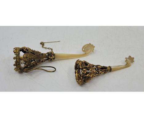 A 19th century gilt metal and mother of pearl posy holder, having pierced and engraved coronet top with clip, fitted pin, to 