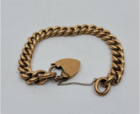 A 15ct. rose gold bracelet curb link bracelet, with 15ct. gold heart padlock clasp. (21.7g)