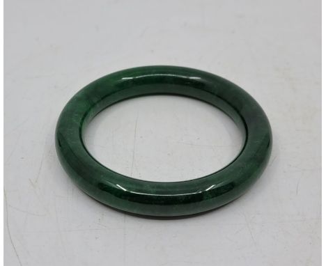 A spinach jade bangle, outer diameter 80mm.