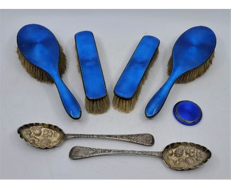 A pair of George III silver berry spoons, by Robert Rutland, London 1807,&nbsp;(112.3g), together with a&nbsp;silver and blue