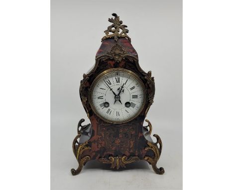 A French 19th century gilt metal mounted Boulle mantle clock, gong strike, having white enamel dial with Roman numeral chapte