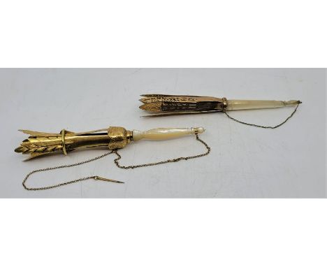A 19th century gilt metal and mother of pearl posy holder, having four section gilt metal feather form top with locking ring 