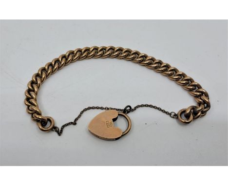 A 9ct. rose gold curb link bracelet, with 9ct. gold heart padlock clasp. (11.6g)