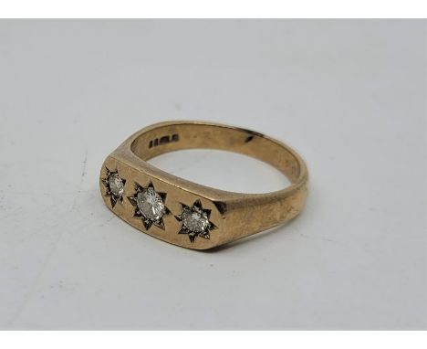 A 9ct. gold three stone diamond ring, London 1980, gypsy set three graduated round brilliant cut diamonds, (centre stone aprr