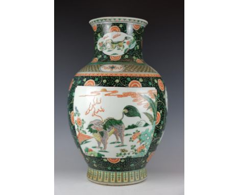 Huge Chinese porcelain wucai vase with qilin-kangxi mark-19th century. Height 61 cm. A Small restoration at the rim.