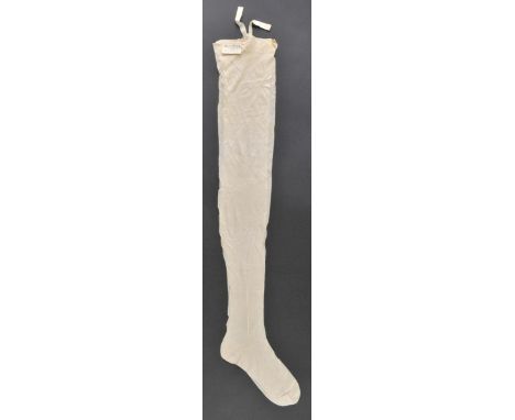 *Victoria (Queen of Great Britain & Ireland, 1819-1901). A pair of silk stockings worn by Queen Victoria, cream silk stocking