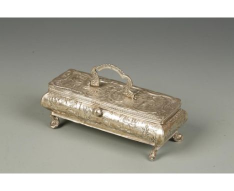 A CONTINENTAL TRINKET BOX of shaped rectangular form with a swing handle, on down-curving feet, the body embossed with huntin