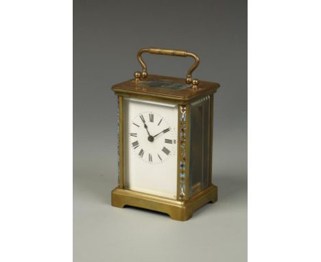 A FRENCH BRASS CASED CARRIAGE CLOCK, the white enamel dial with Roman numerals, the brass case with enamelled columns to the 