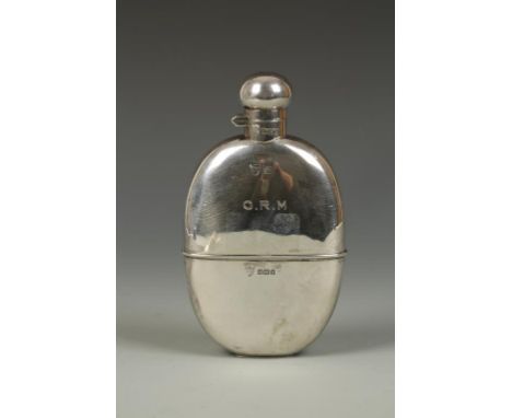 A HIP FLASK of oval form with bayonet fitting cap and pull-off cover, initialled, by G&J/WM, Sheffield 1910, 6" long