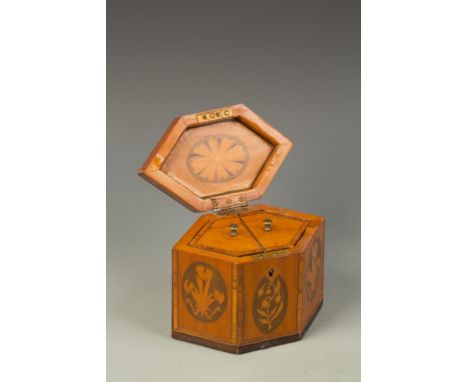A GEORGE III SATINWOOD AND MARQUETRY HEXAGONAL TEA CADDY, the shaped top with a central marquetry pattera, within narrow cros