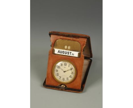 A SWISS EIGHT DAY DESK CLOCK, the round dial with Arabic numerals and date aperture, inscribed 'Sir John Bennett Ltd. London'