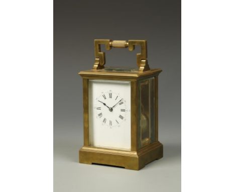 A FRENCH BRASS CASED STRIKING CARRIAGE CLOCK, the white enamel dial with Roman numerals and outer Arabic seconds numerals, st