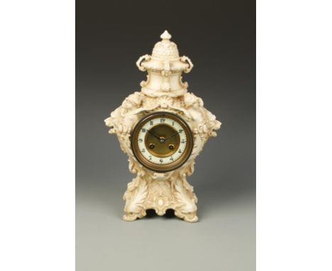 A 19TH CENTURY PORCELAIN CASED MANTEL CLOCK, the circular dial with twin winding holes and Arabic numerals, within an elabora