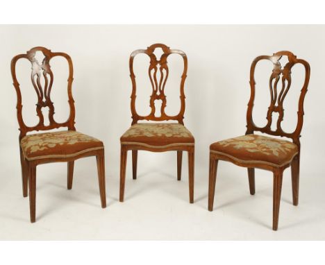 A SET OF SIX DUTCH FRUITWOOD DINING CHAIRS, the cartouche-shaped backs with pierced splats over serpentine seats with floral 