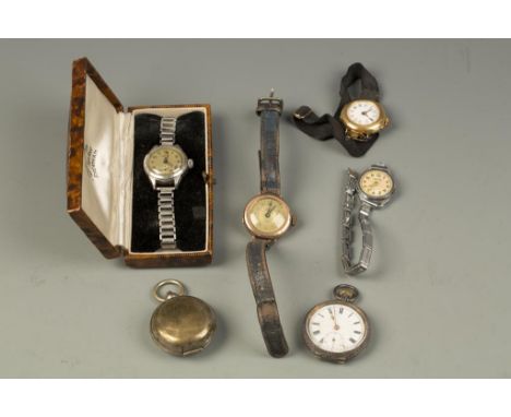 A LADIES VICTORIAN YELLOW GOLD WRIST WATCH, the round dial with Arabic numerals, attached to a black silk strap, three other 